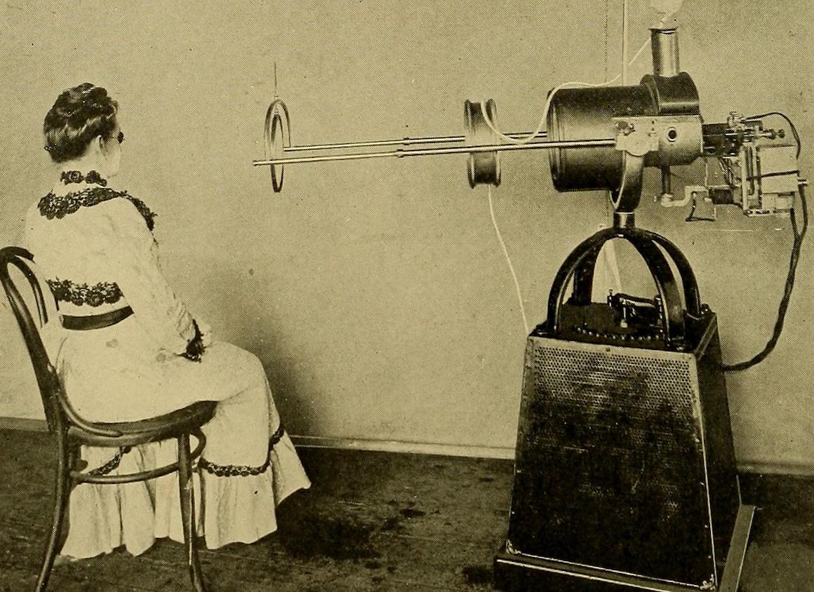 Vintage photograph of a woman and an X-ray machine