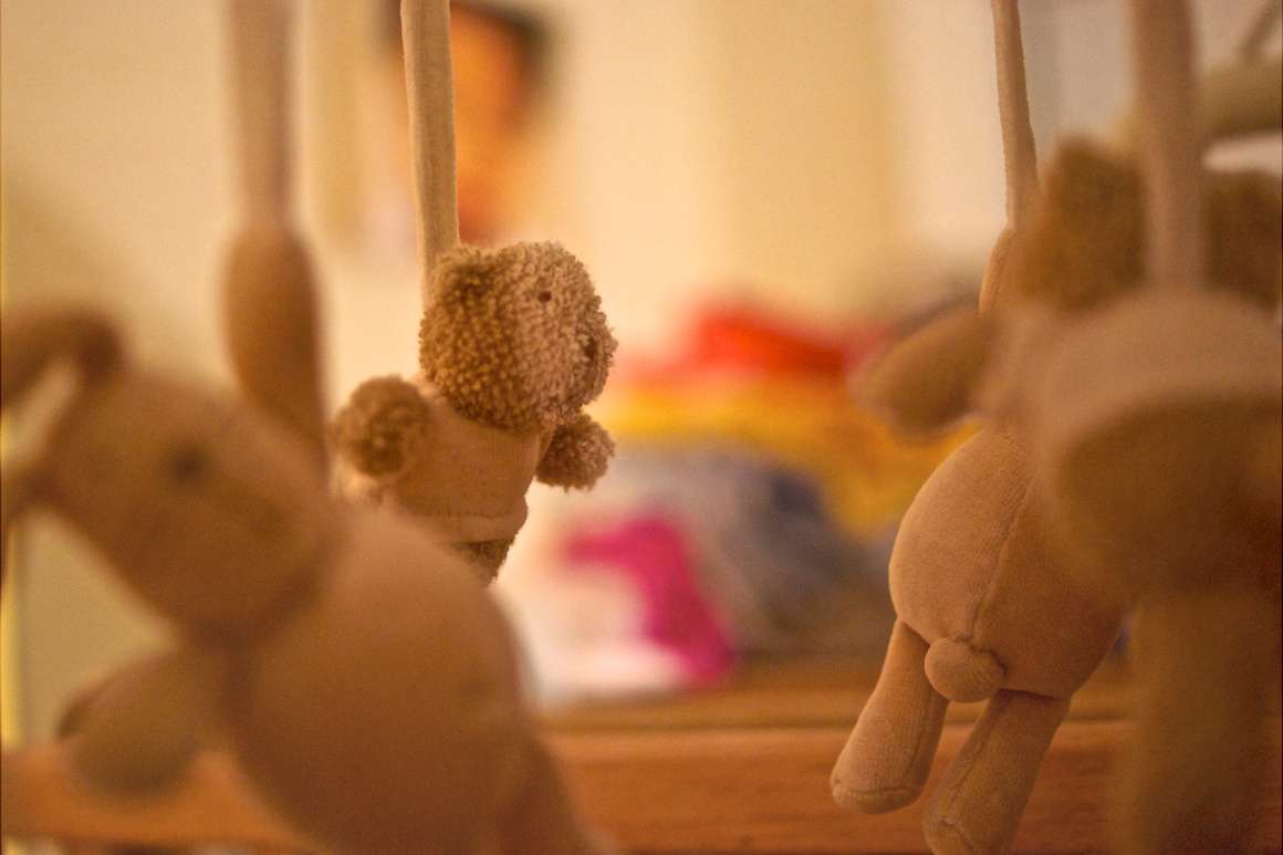 a child's mobile of stuffed bears