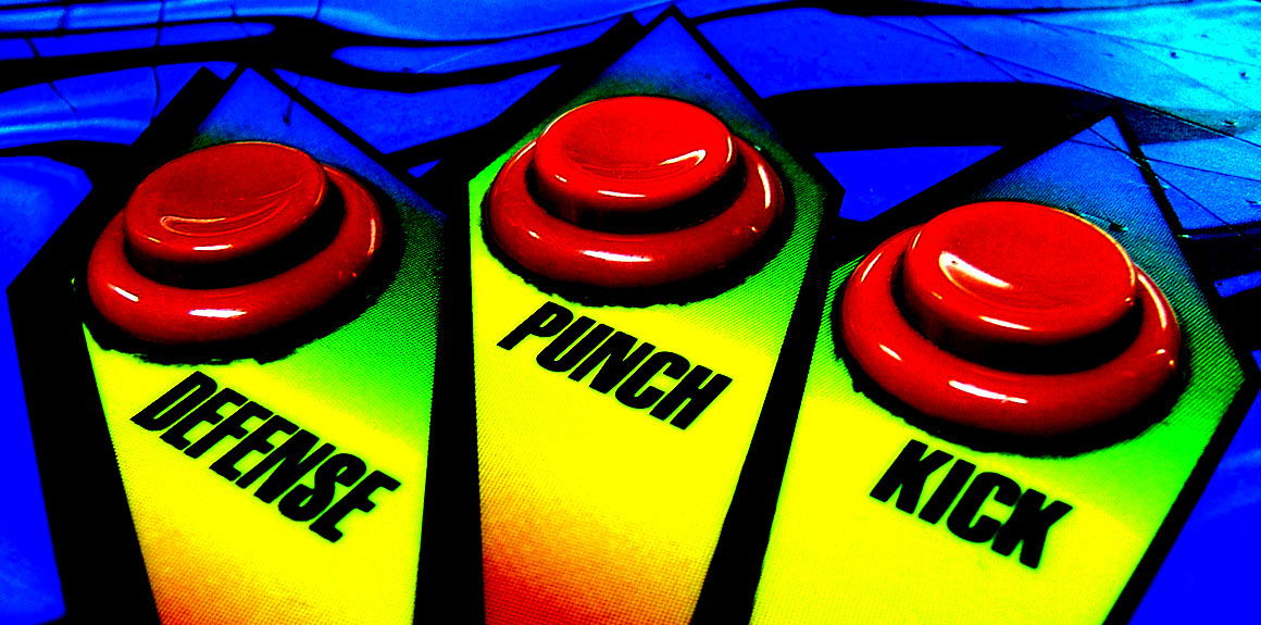 buttons on an arcade game labeled "defense," "punch" and "Kick"